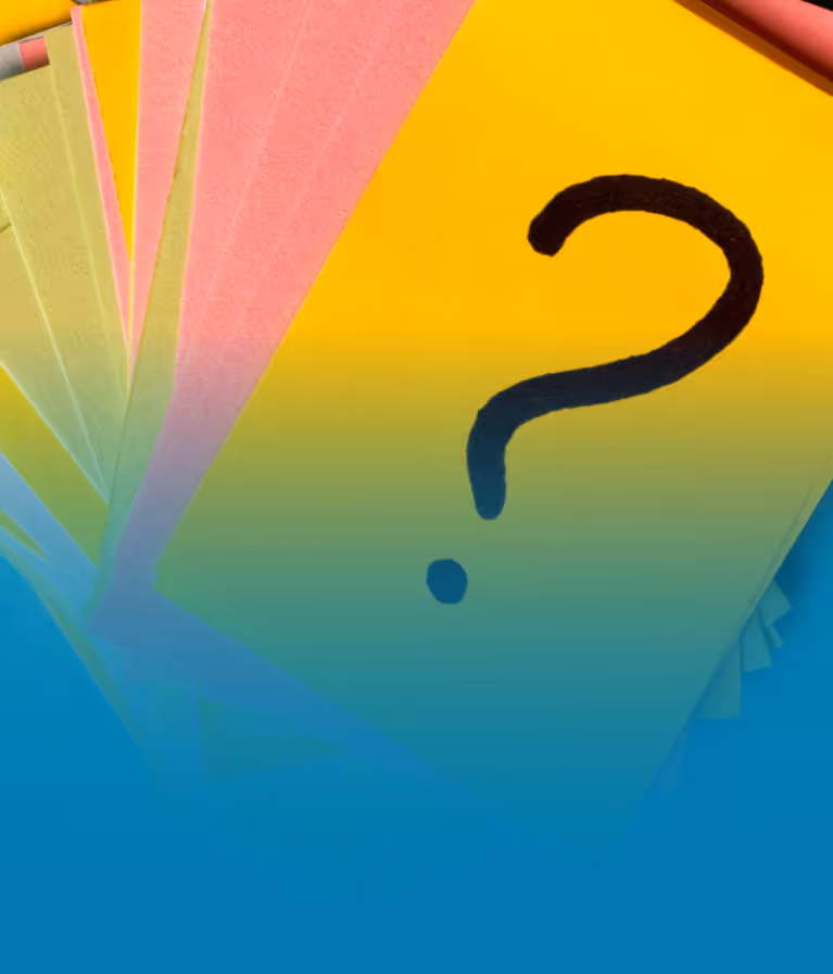 A bunch of question marks on a yellow sheet of paper