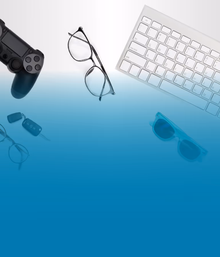 A keyboard, glasses, and a controller on a blue background