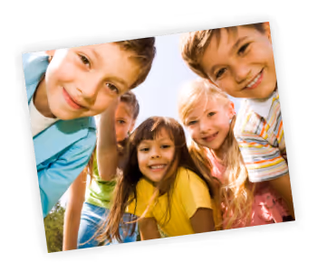 A group of young children standing next to each other