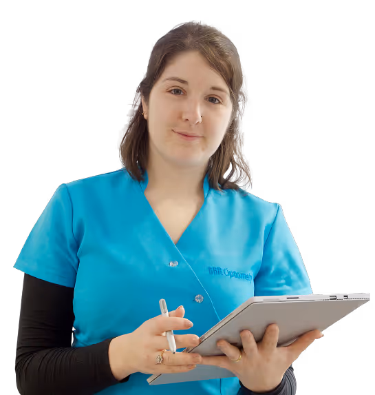 A woman in a blue shirt holding a tablet