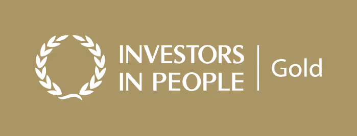 A brown background with a white logo and the words investors in people gold