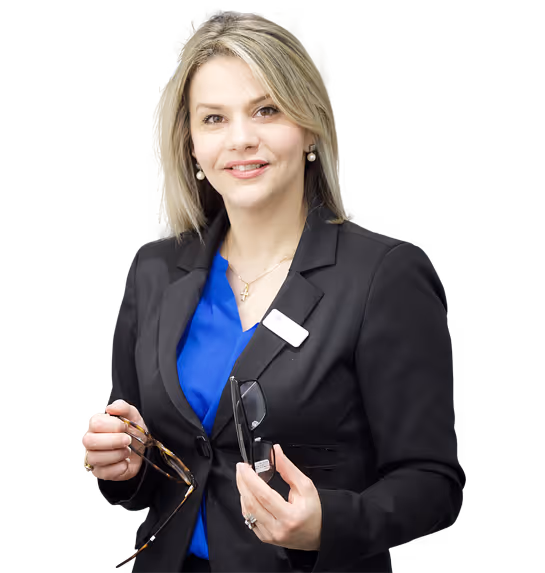 A woman in a business suit holding a cell phone