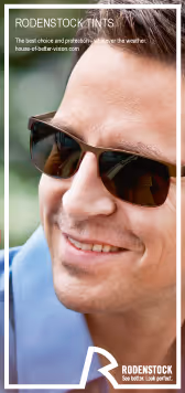 A man wearing sunglasses and a blue shirt