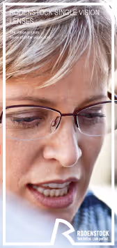 A woman wearing glasses looking at her cell phone