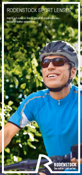 A man riding a bike wearing a helmet and sunglasses