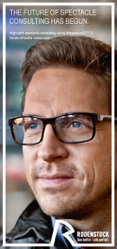 A man wearing glasses and a black jacket