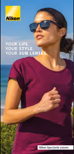 A woman in a purple shirt and sunglasses