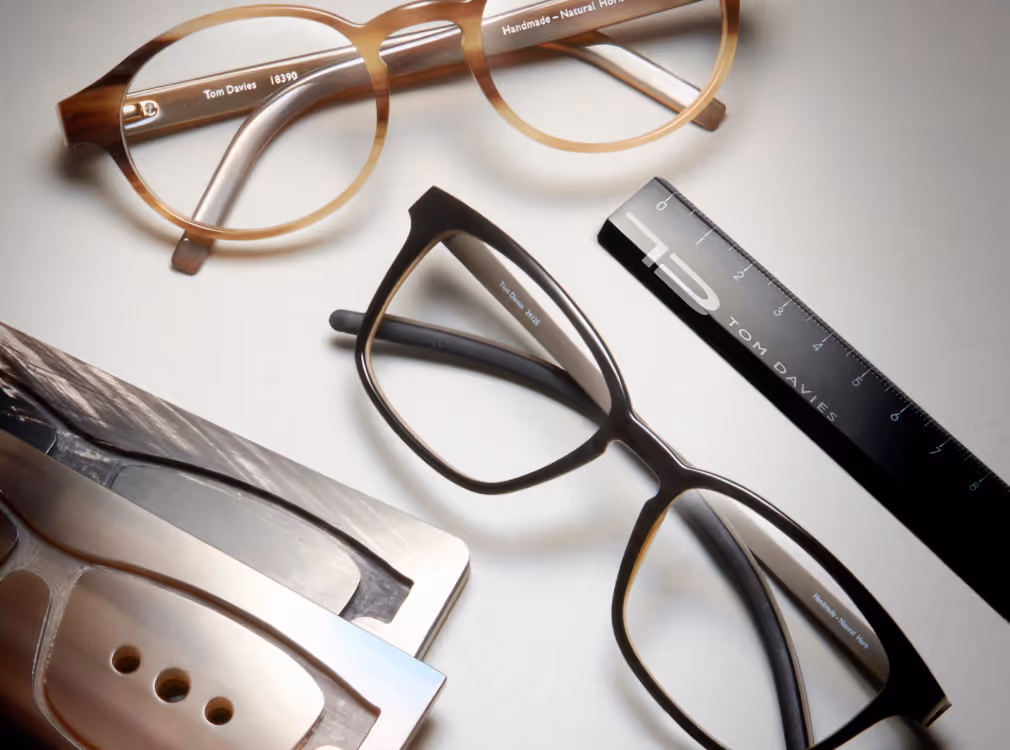 A pair of glasses sitting on top of a table