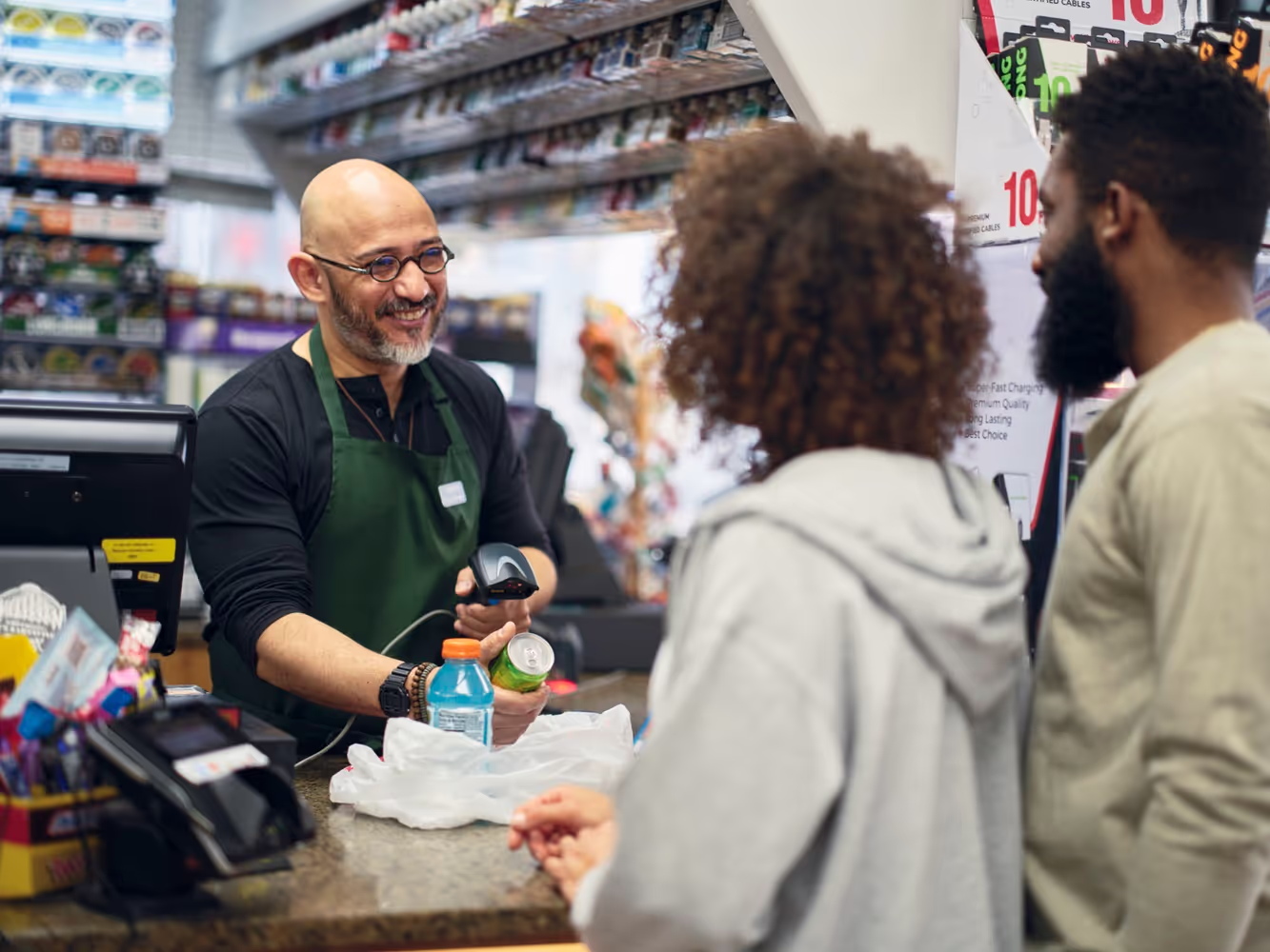 Man and woman buying in convenience store