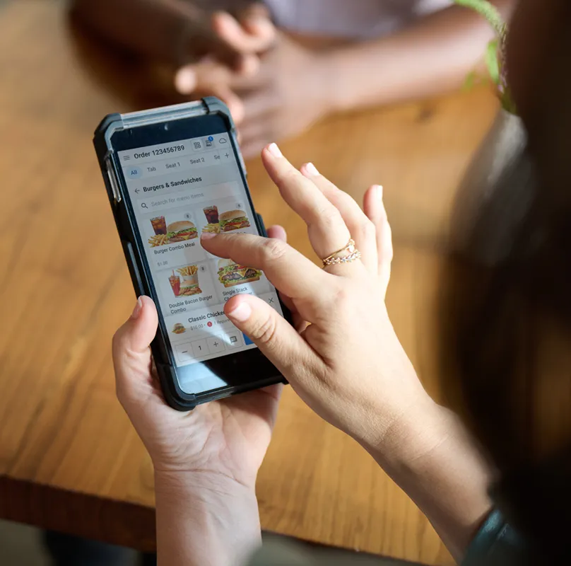 Hendheld Device with payments app by NCR Voyix