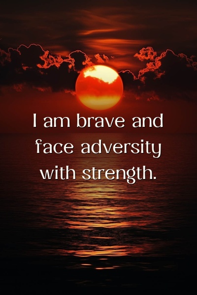 Affirmation about facing adversity with strength on a sunrise background