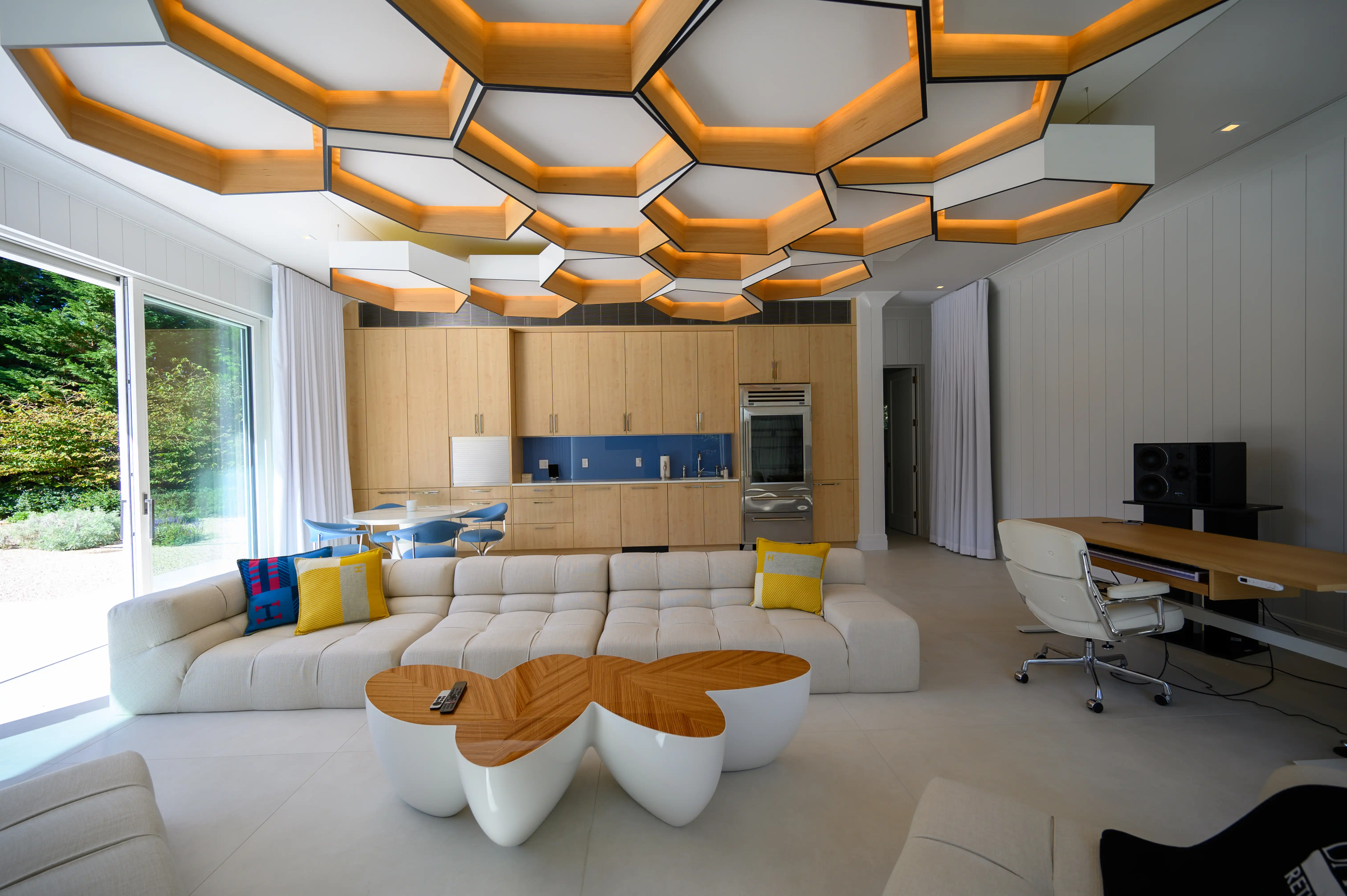 Modern luxury living room with geometric ceiling design