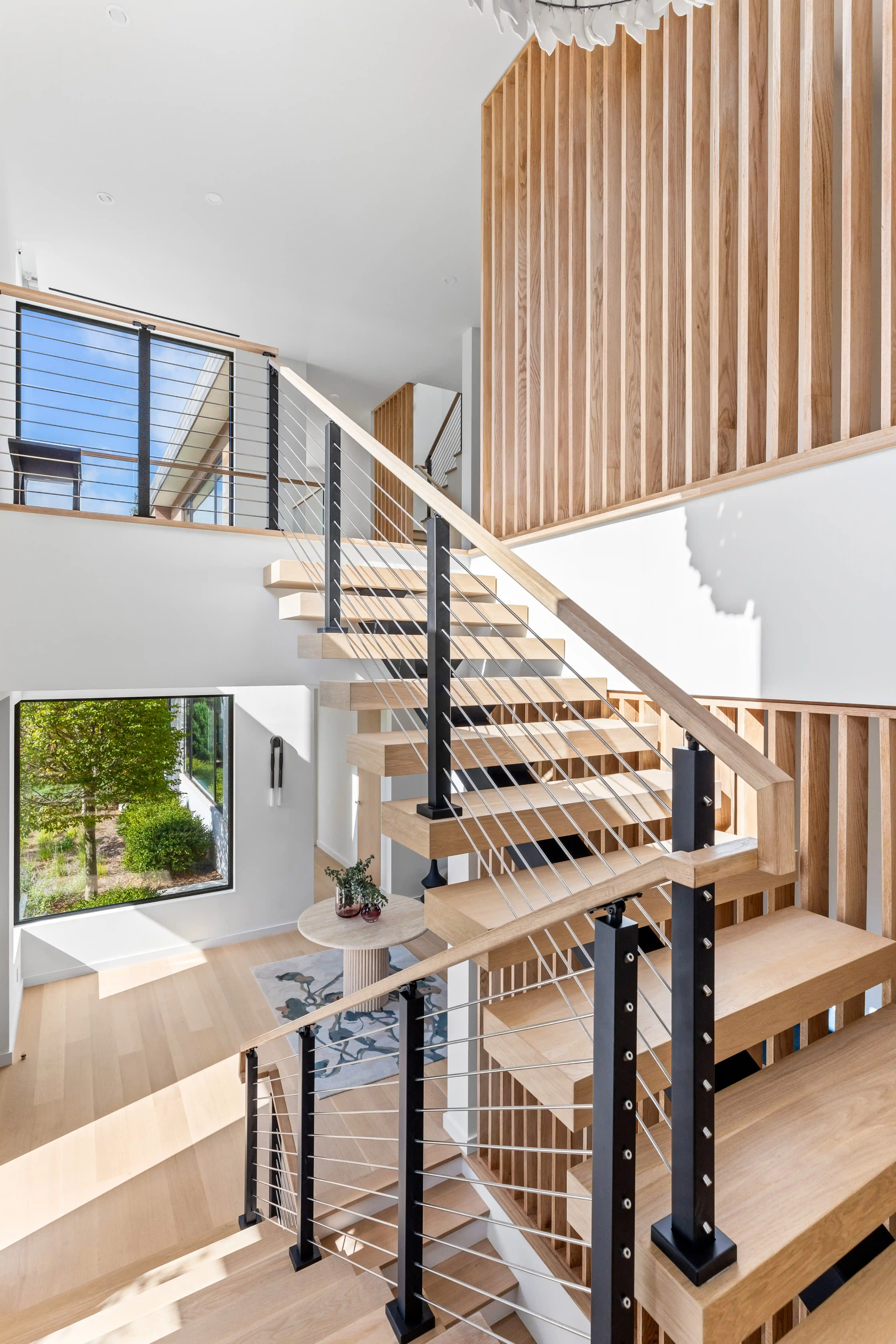 Custom residential staircase with minimalist modern design and wood paneling