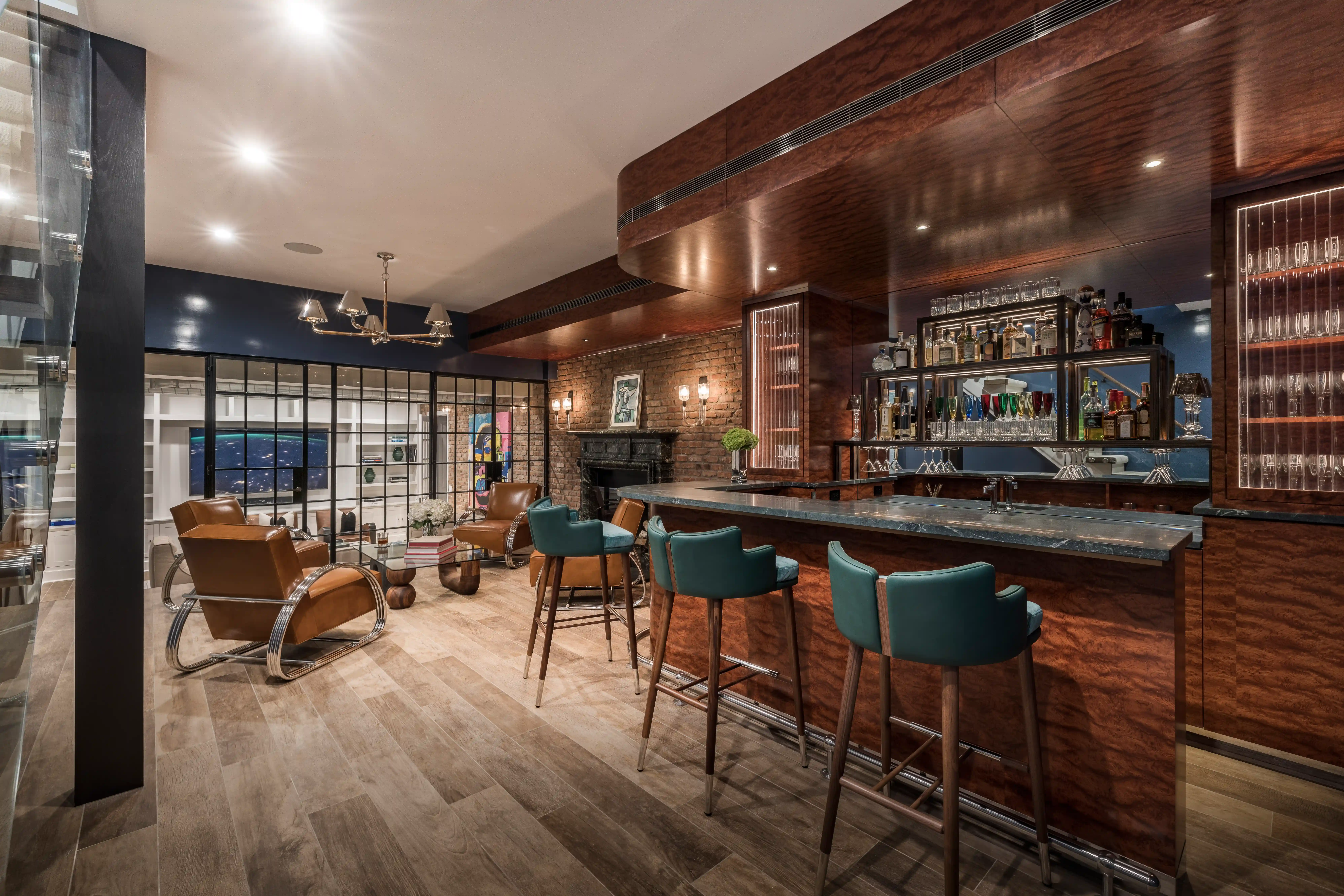 Modern luxury entertainment room with custom bar and lounge seating 