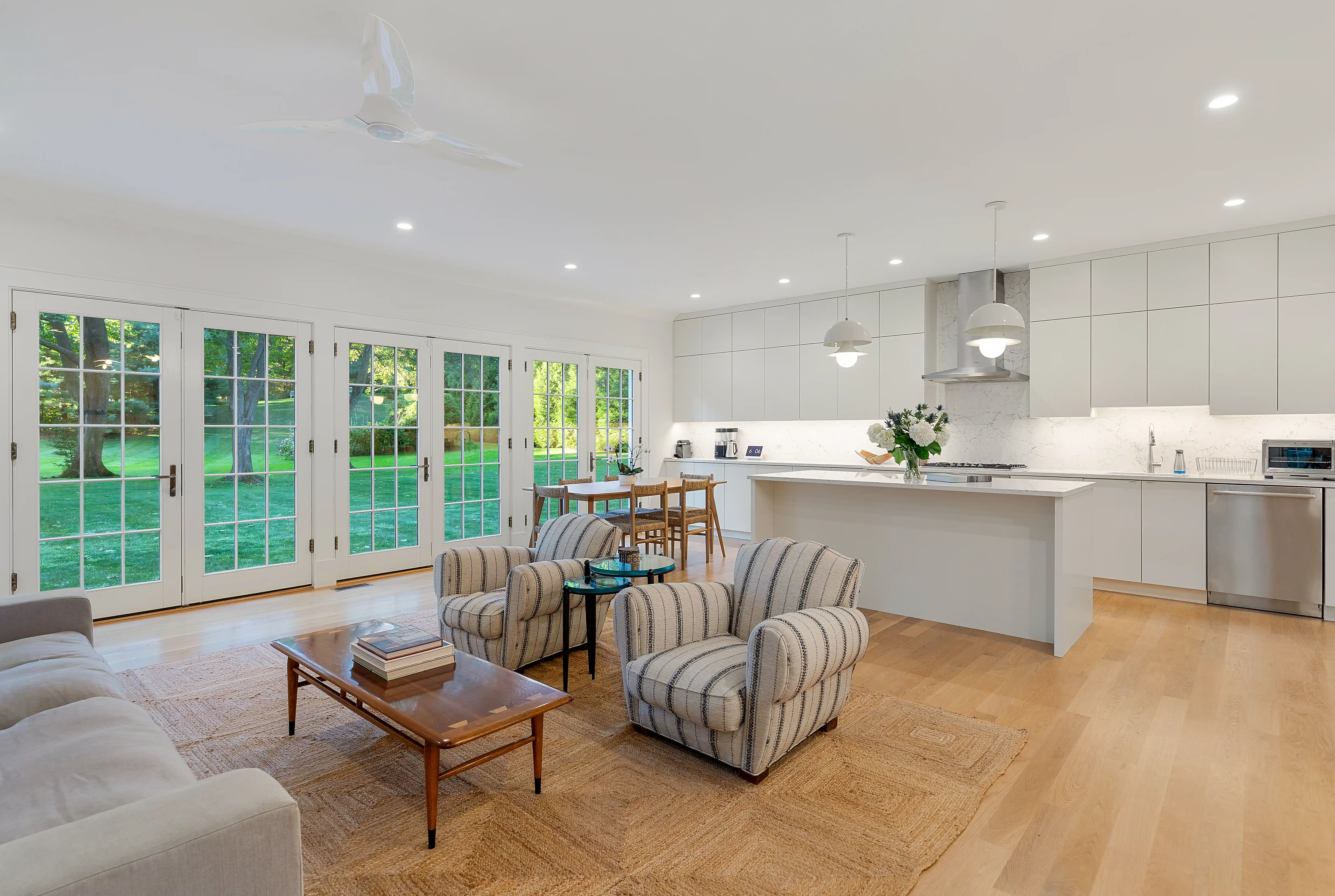 Open-concept kitchen and living room in a modern custom luxury home