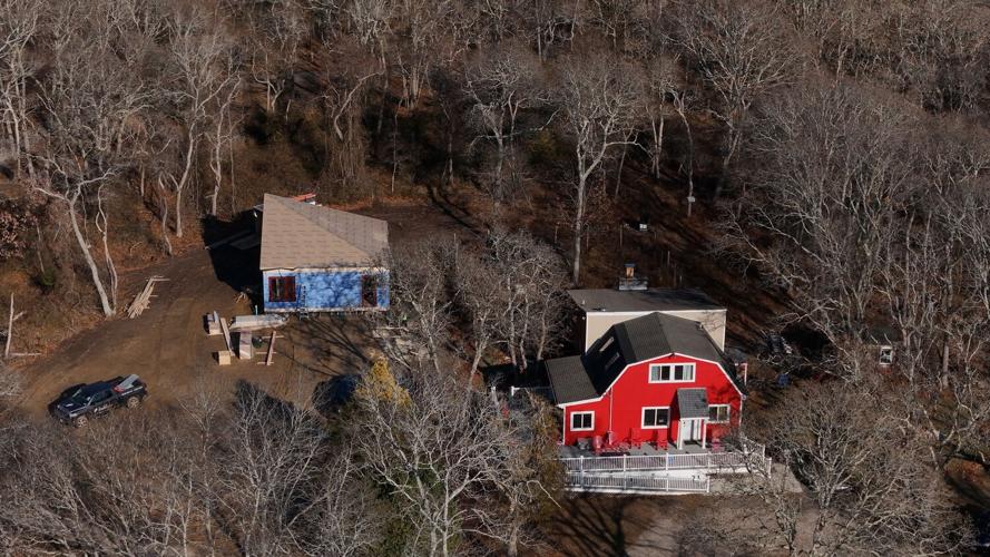Prefabricated home integrated into a wooded property