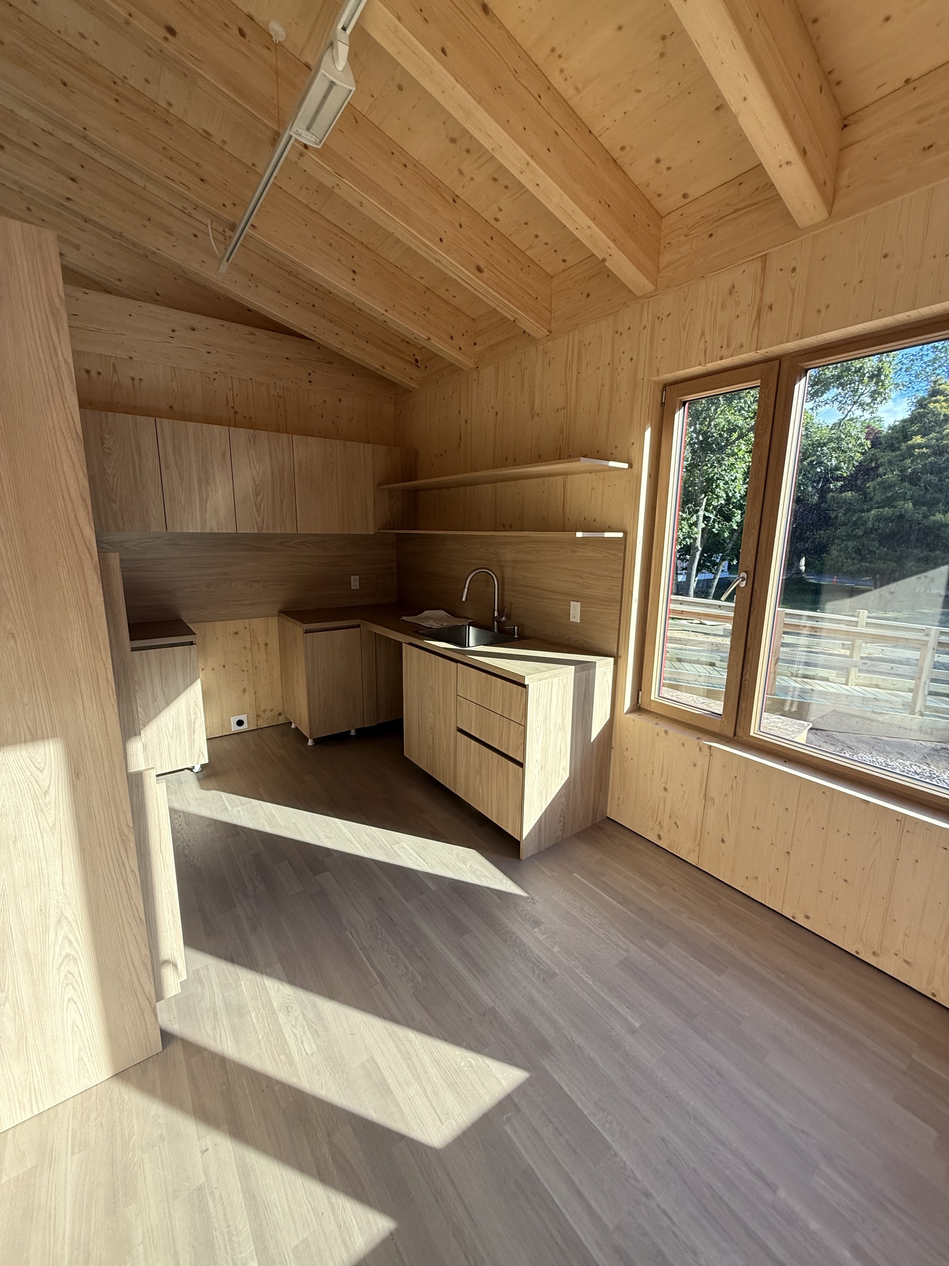 Natural wood kitchen and living space within the MH modular home