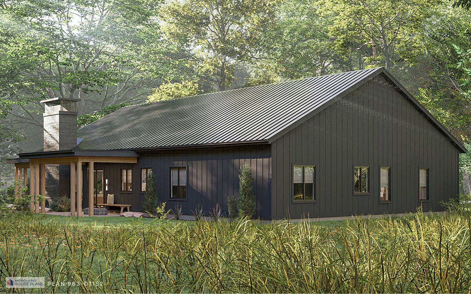 Angled rear perspective of a contemporary black farmhouse with covered porches, stone chimney, and wooded setting