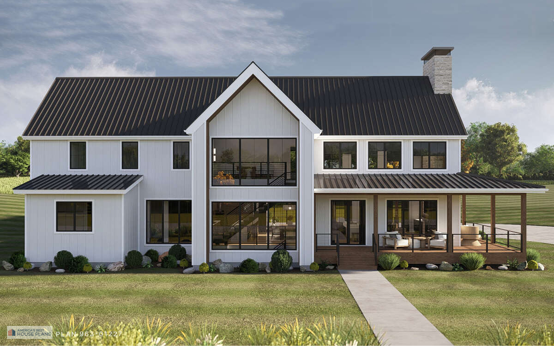 Modern white Barndominium with black metal roof, wraparound porch, and floor-to-ceiling windows