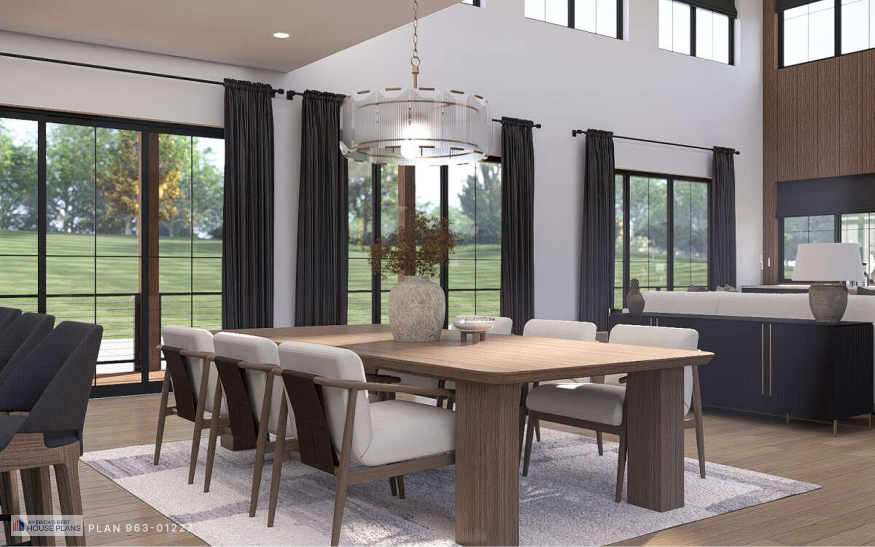Dining room with large windows, modern chandelier, and open living space