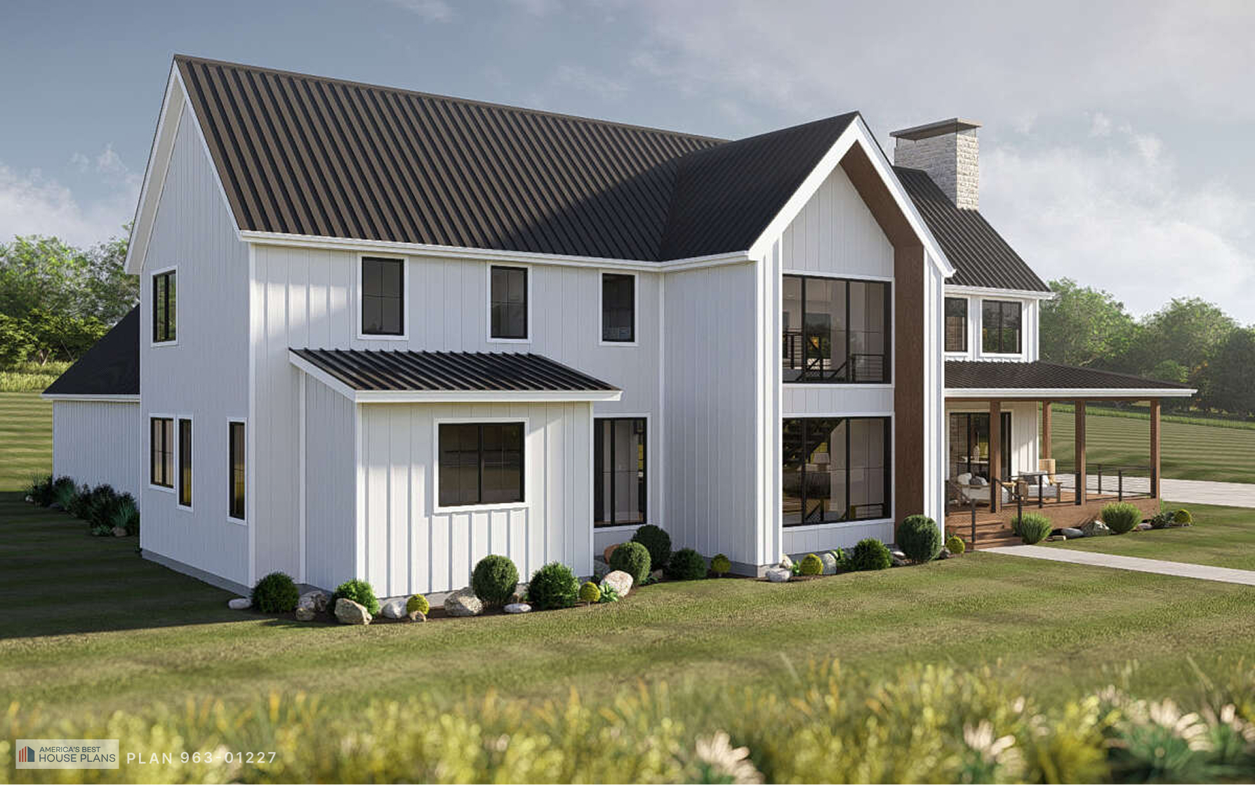 Angled front view of a contemporary Barndominium with large windows, vaulted entry, and covered porch