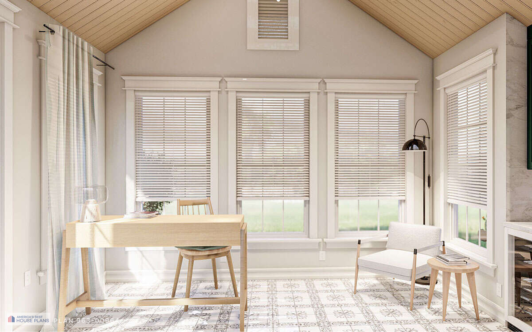 Bright cottage home office with a minimalist wood desk