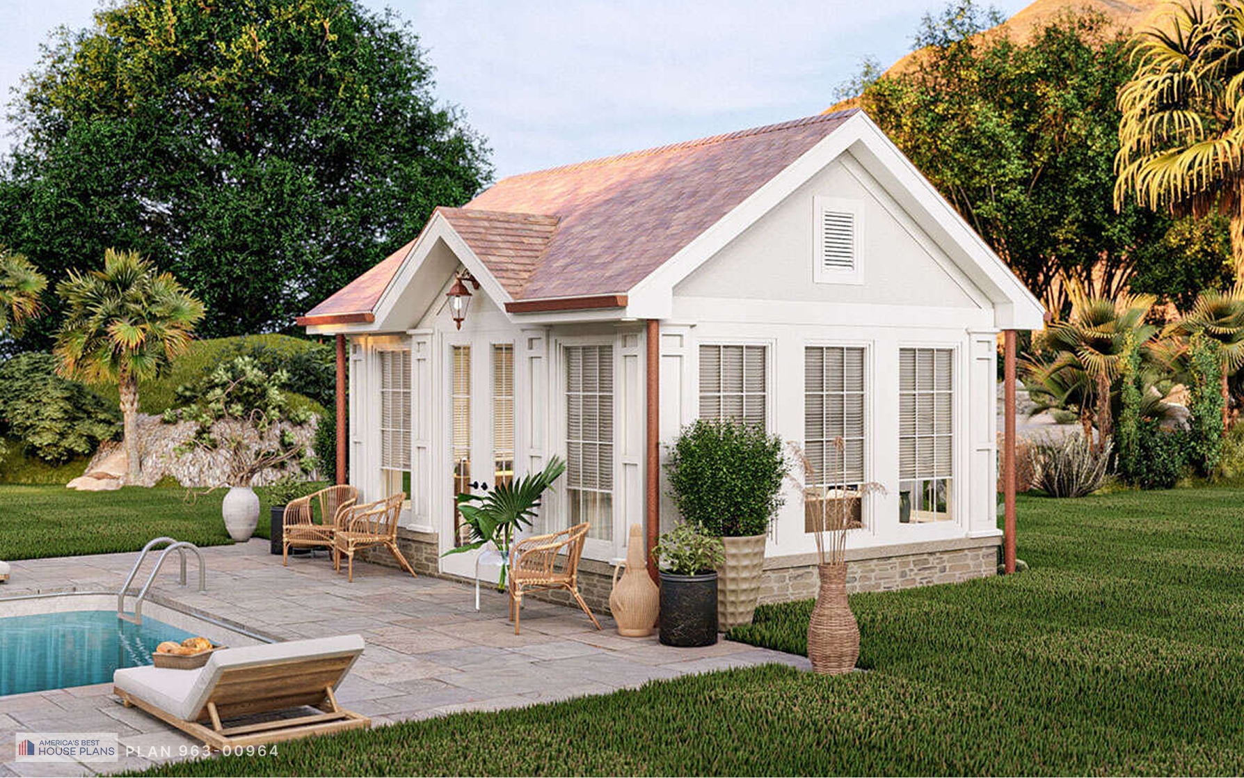 White cottage pool house with wraparound windows