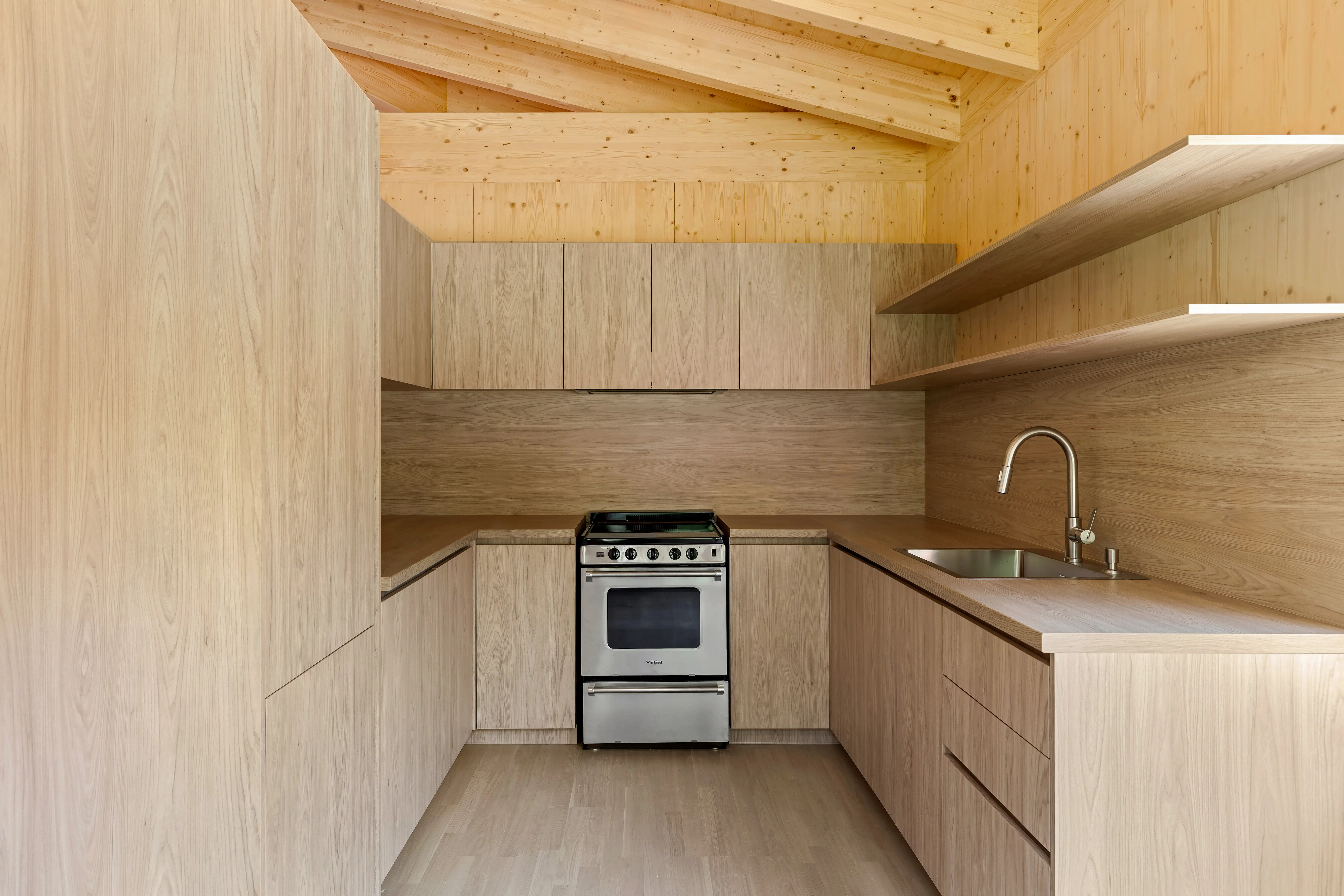 Ma’s House kitchen with natural wood cabinetry