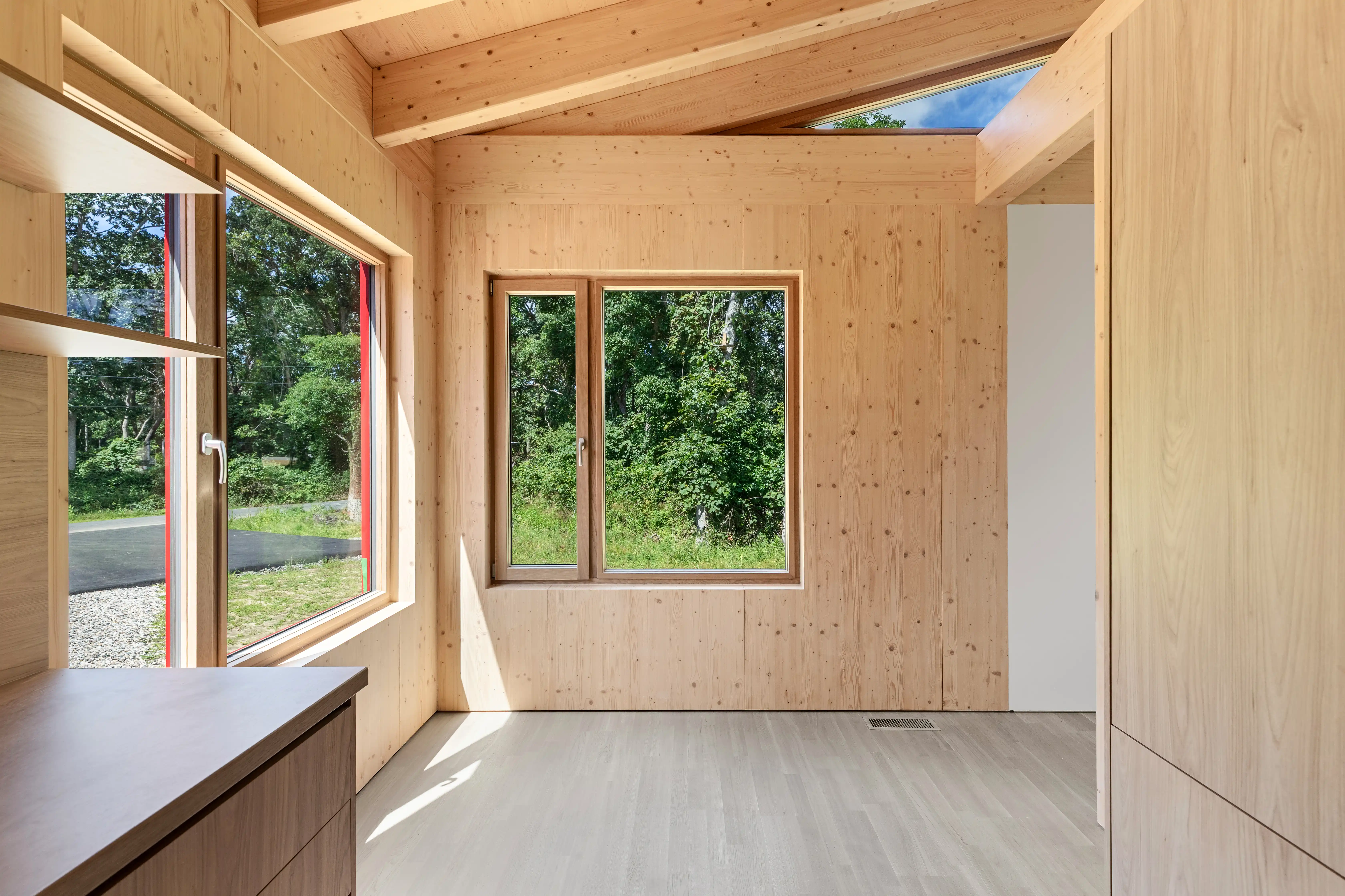 Ma’s House timber interior with large windows and natural light