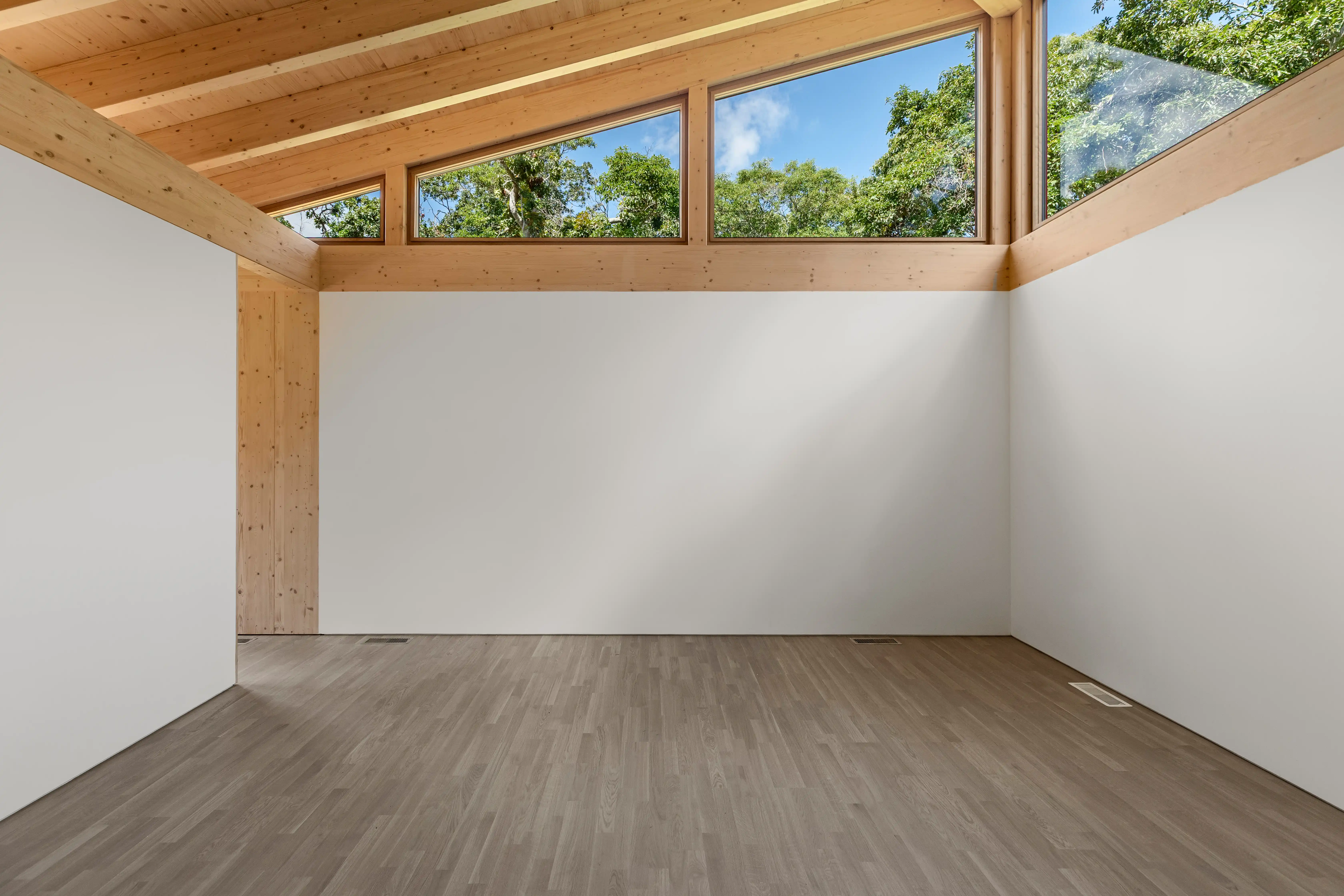 Ma’s House gallery space with clerestory windows and timber beams