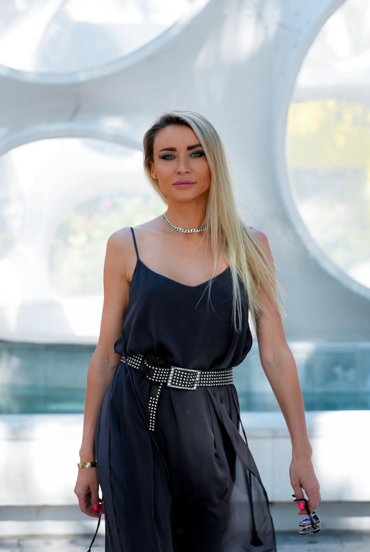 Woman in a black dress at a Miami art installation for a social media reel