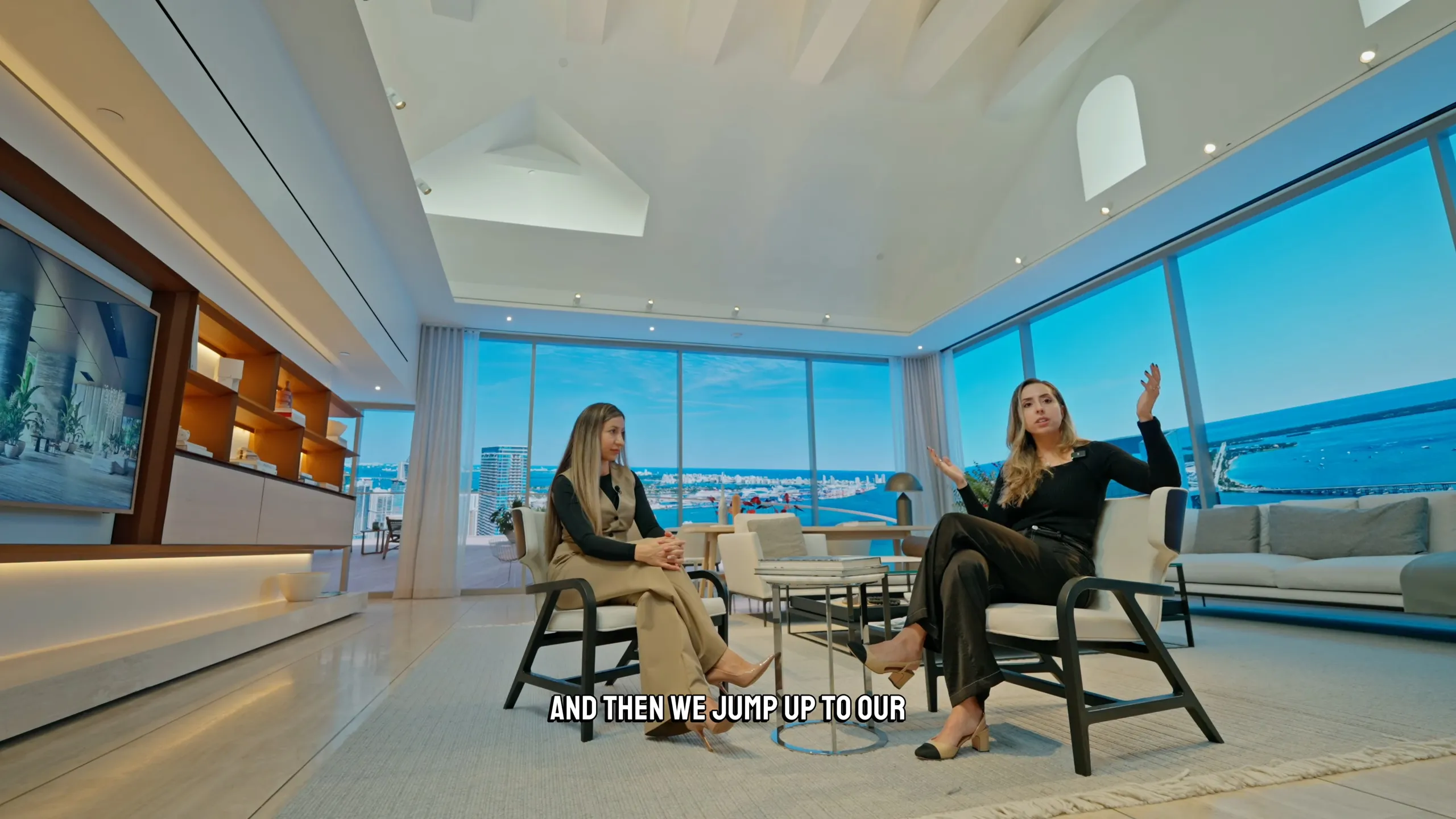 Interview inside a luxury penthouse with ocean views