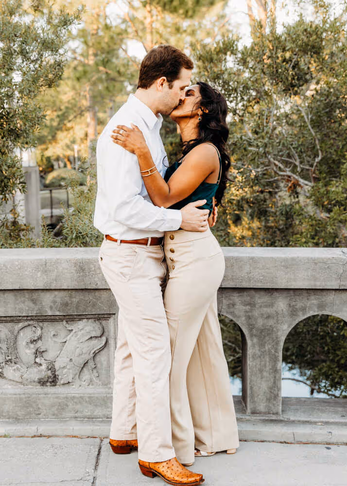 Couple standing on a bridge