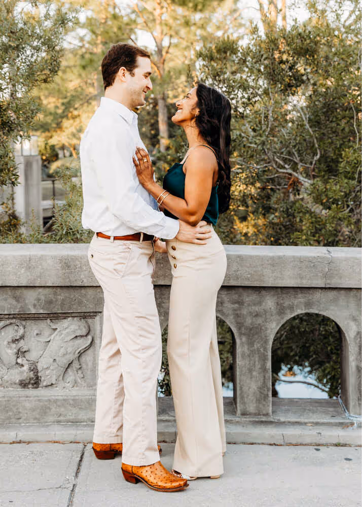 Couple standing on a bridge