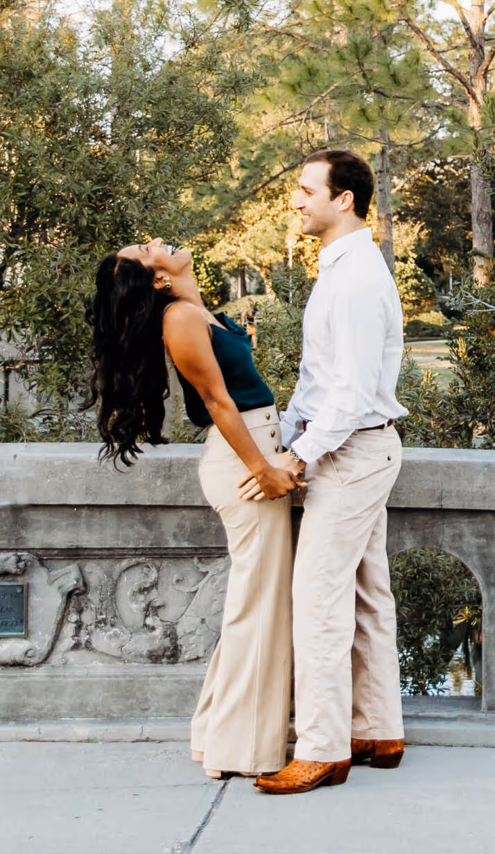 Couple standing on a bridge