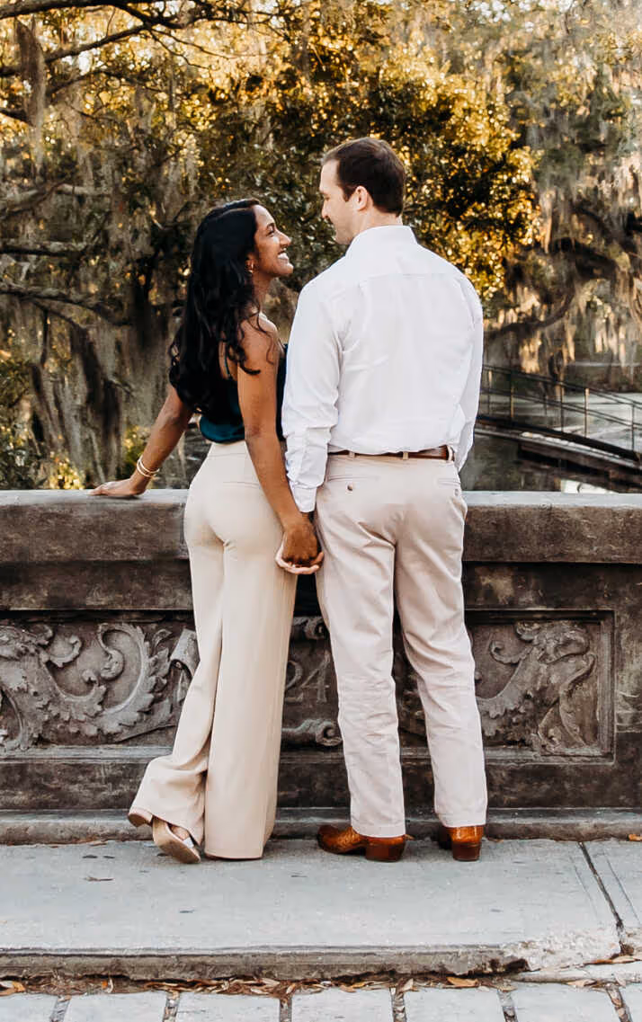 Couple standing on a bridge
