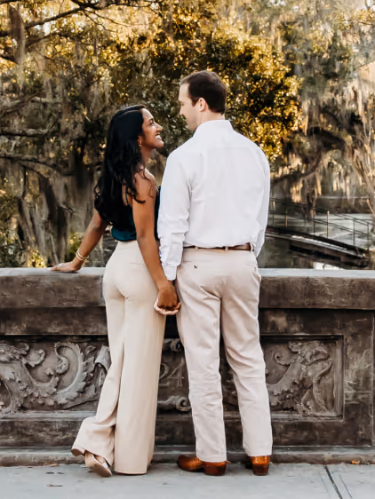 Couple standing on a bridge