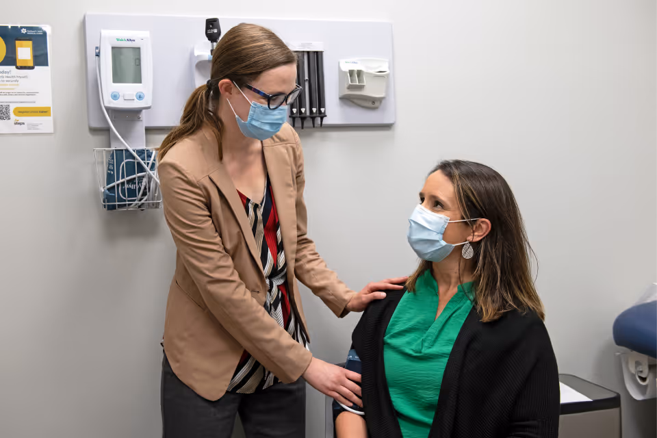 Doctor and nurse with a family