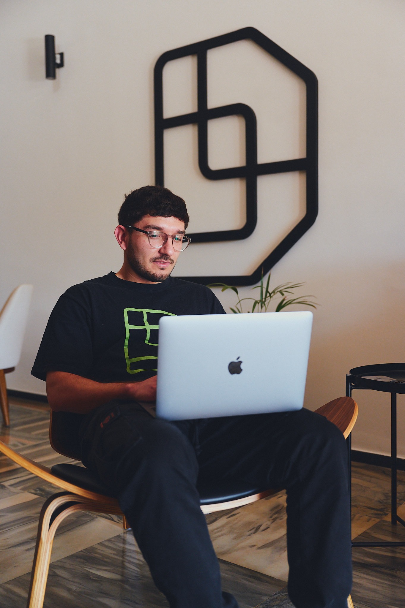 Man working with his computer sitting