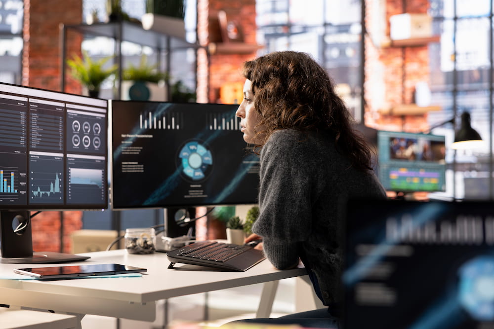 Woman analyzing data at desk