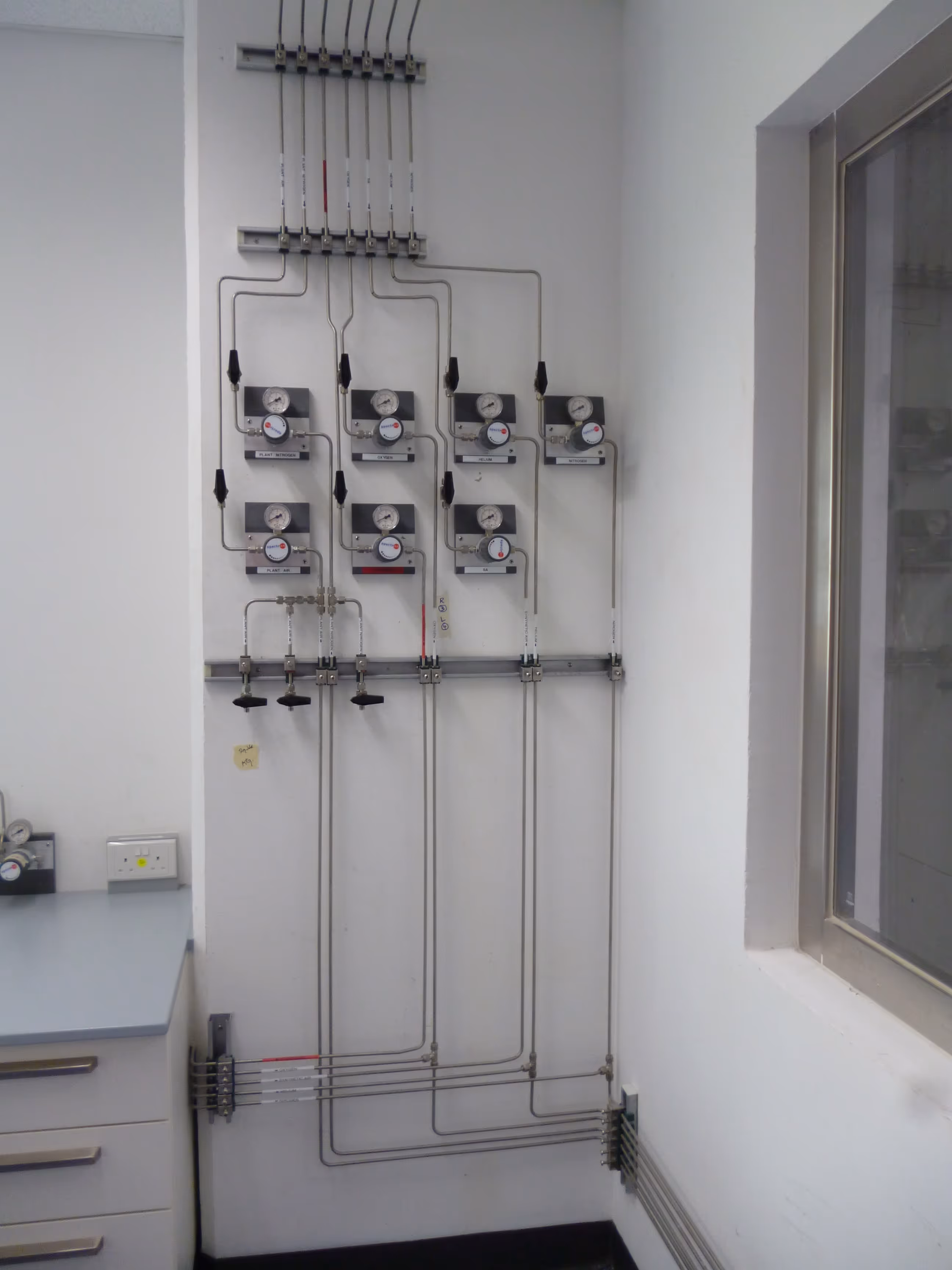 Gas pipeline control panel with multiple pressure gauges and valves