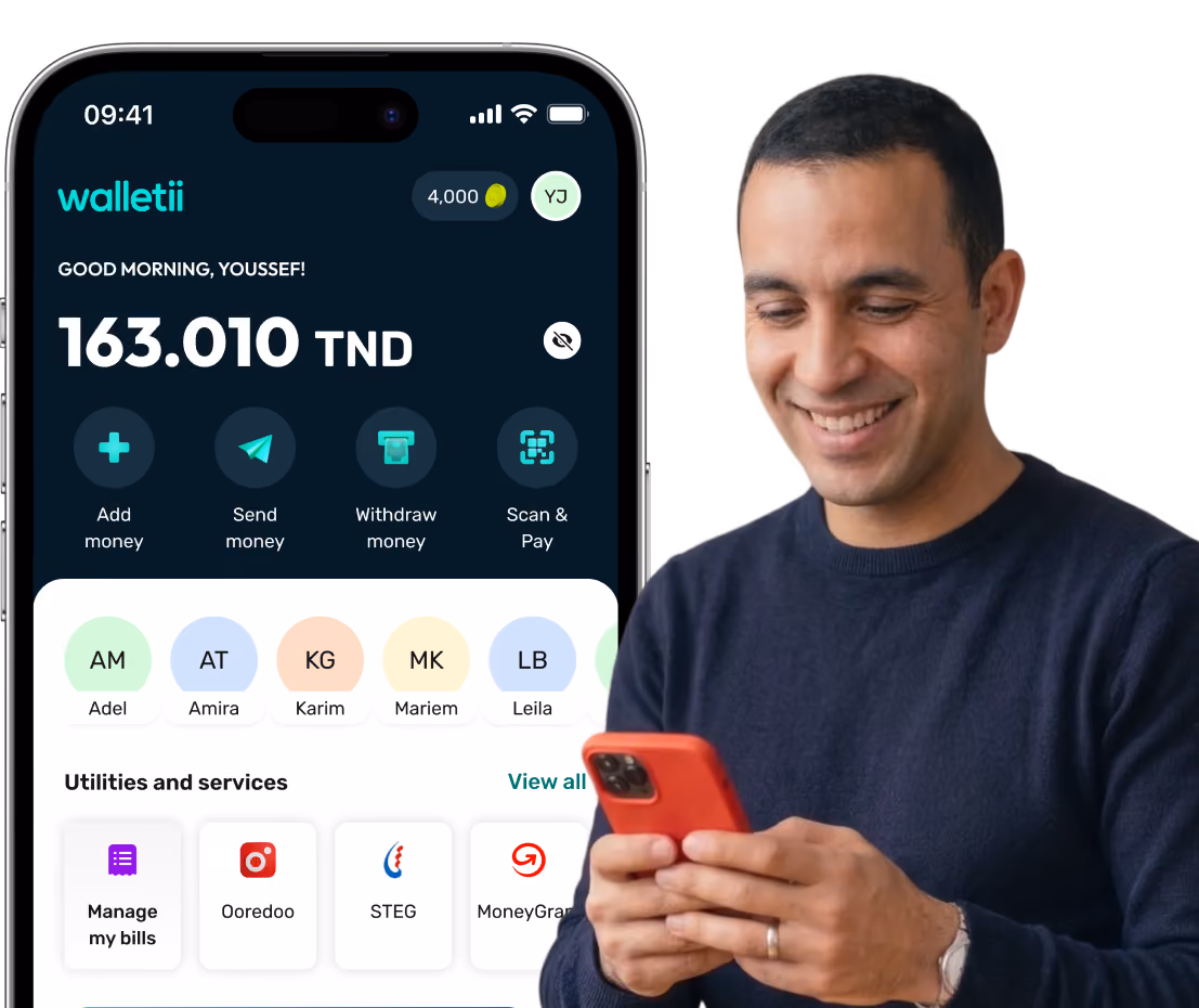 Man smiling while using a red phone beside a mobile app showing wallet balance and money services.