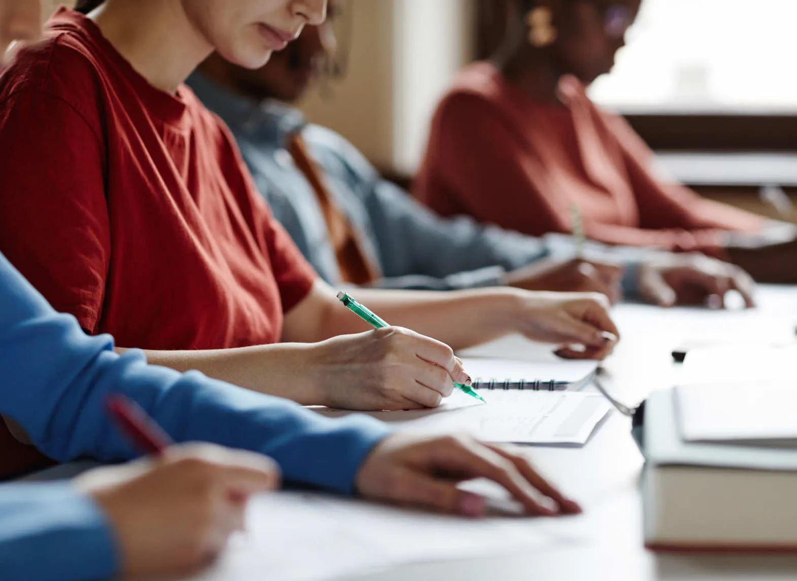 students taking notes during a lecture
