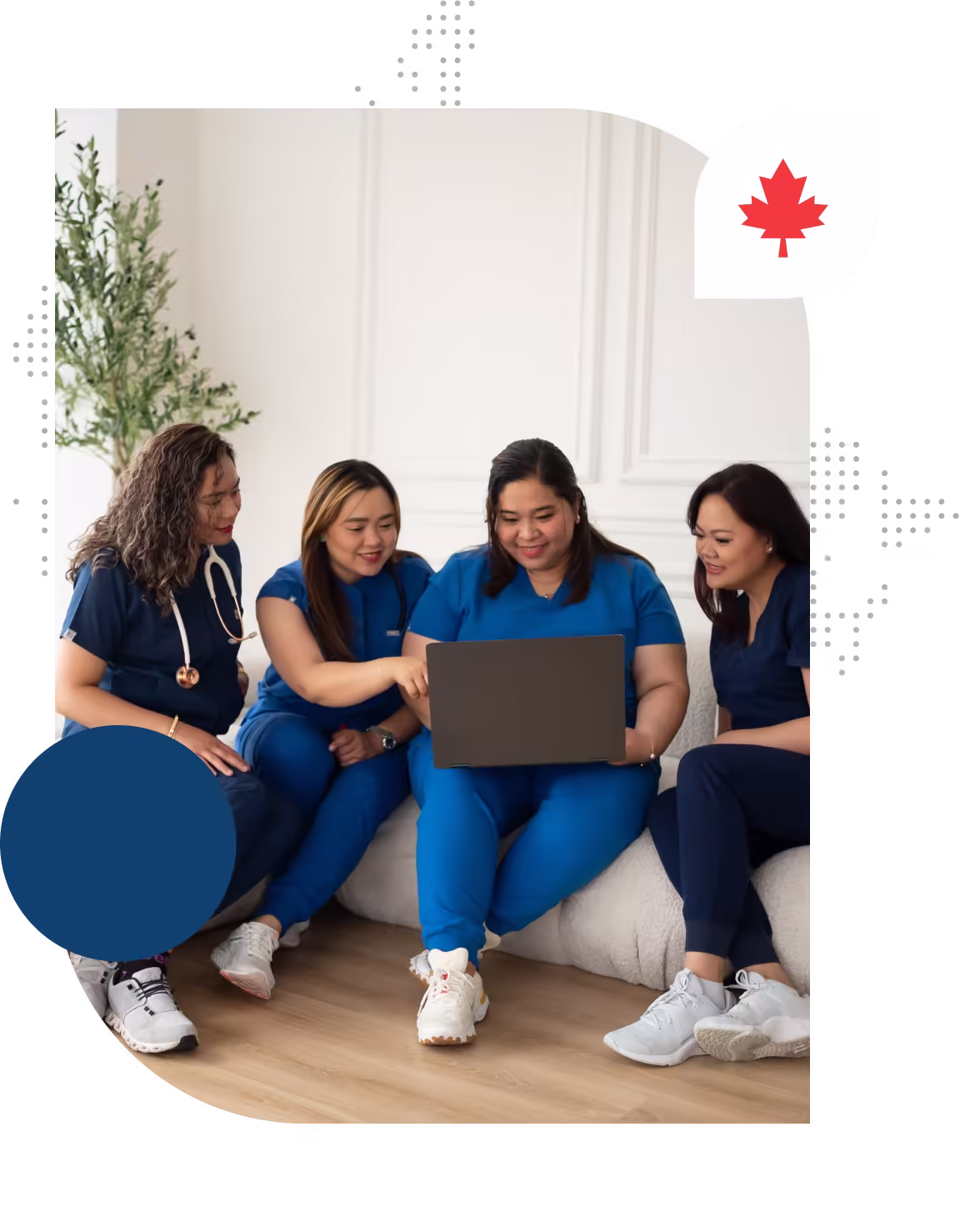 Nurses huddling in front of a laptop