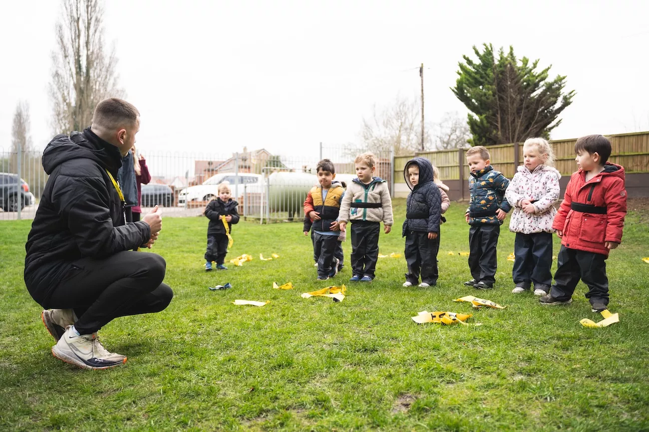 A Delta Sports Coach running a PE lesson at a primary school. 