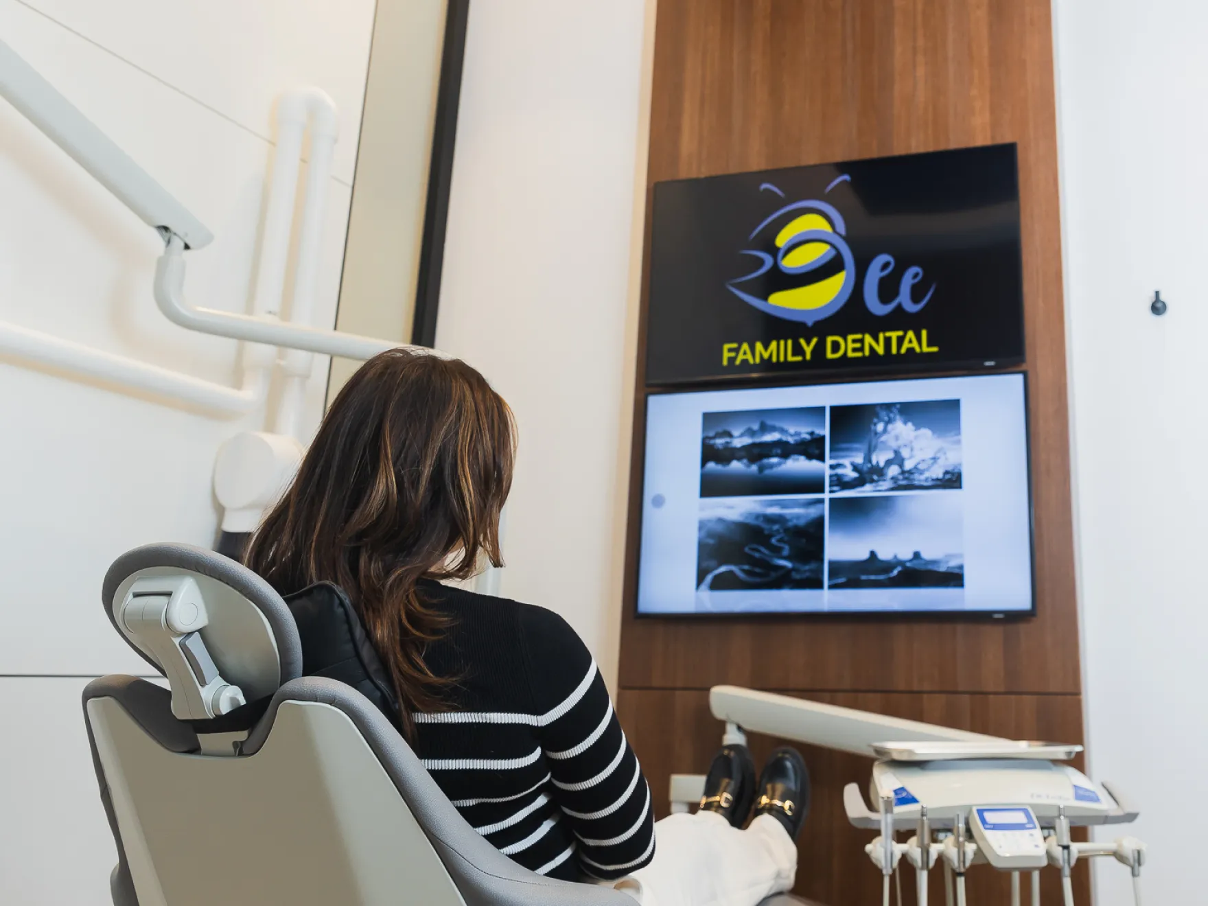 Dental Checkups in Calgary AB | patient sitting at a dentist chair in Bee Family Dental office
