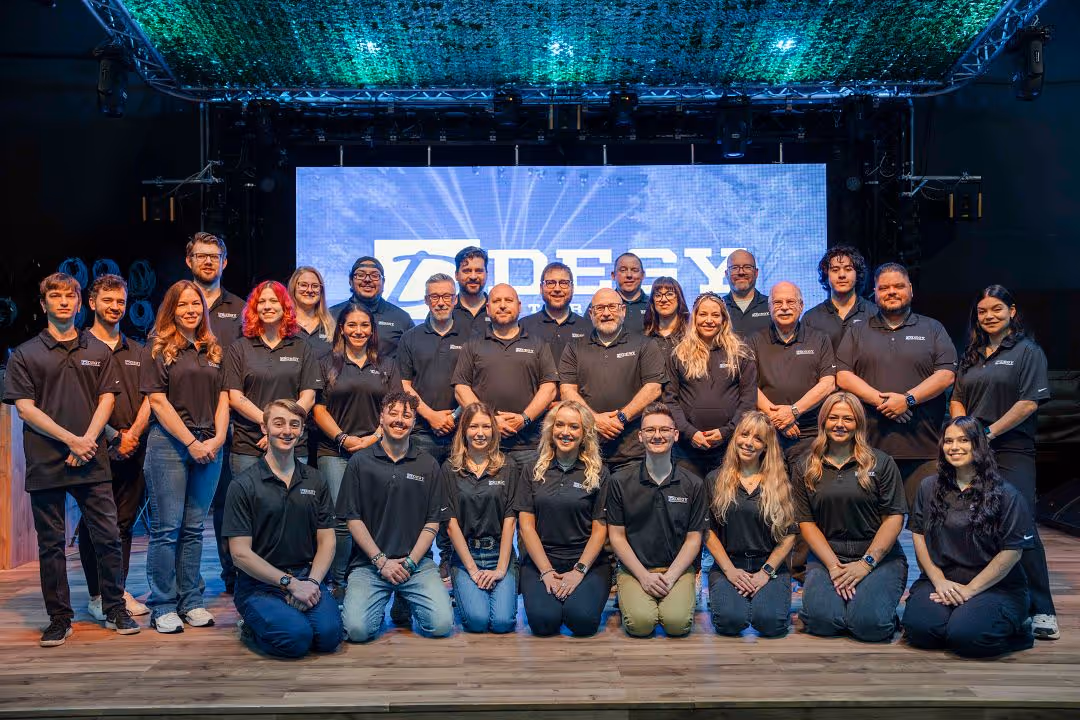 The Degy team gathers together at a conference