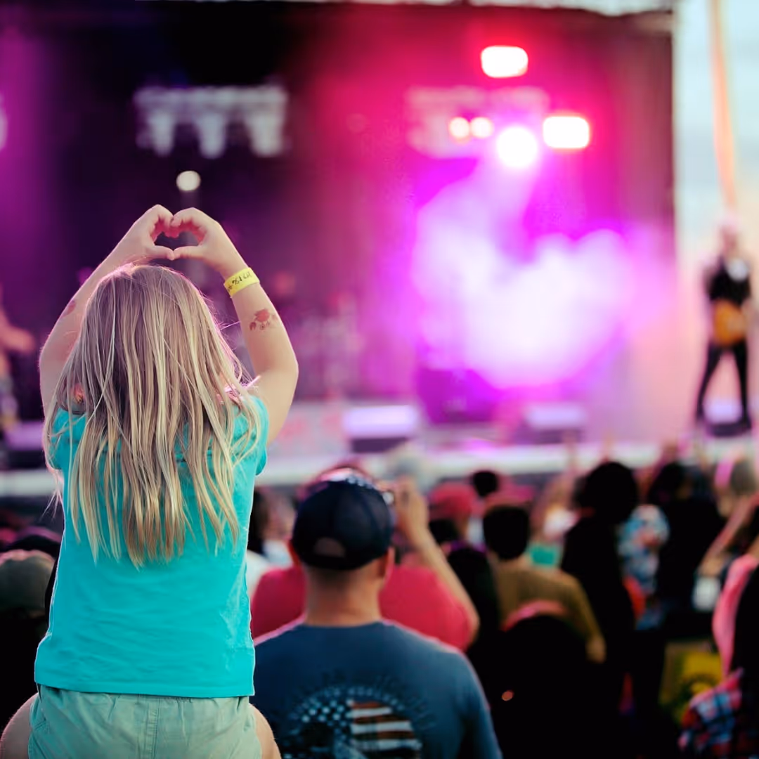 Man on stage performing in front of crowd