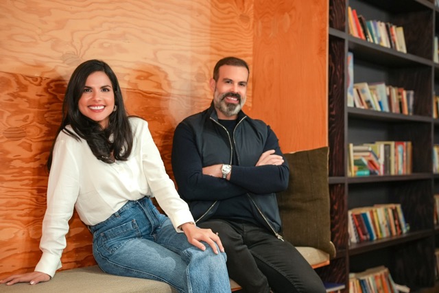 Paula Mejia and Ray Mejia sitting at FCF Brickell Office 