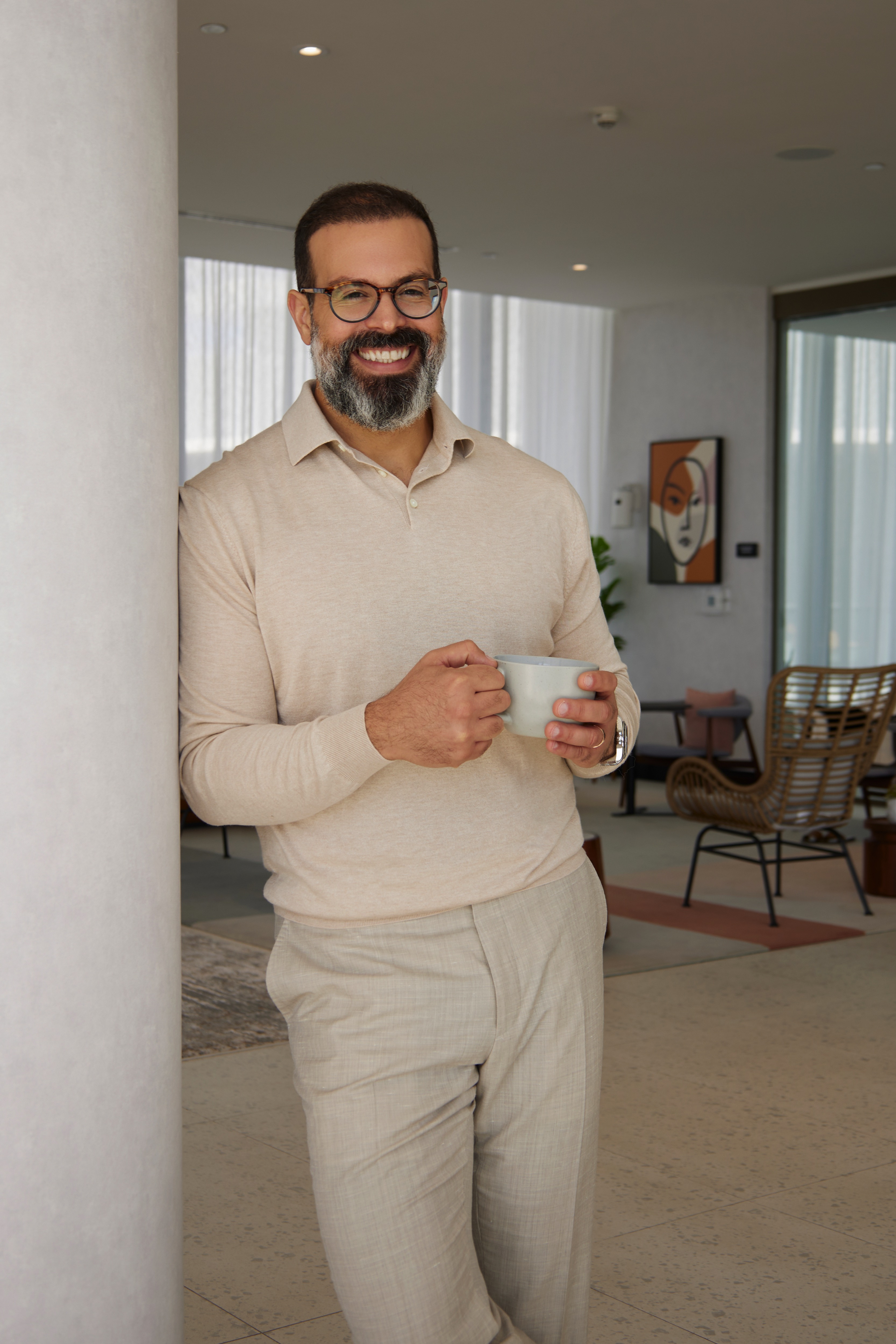 Ray Mejia Standing with Coffee at FCF Office